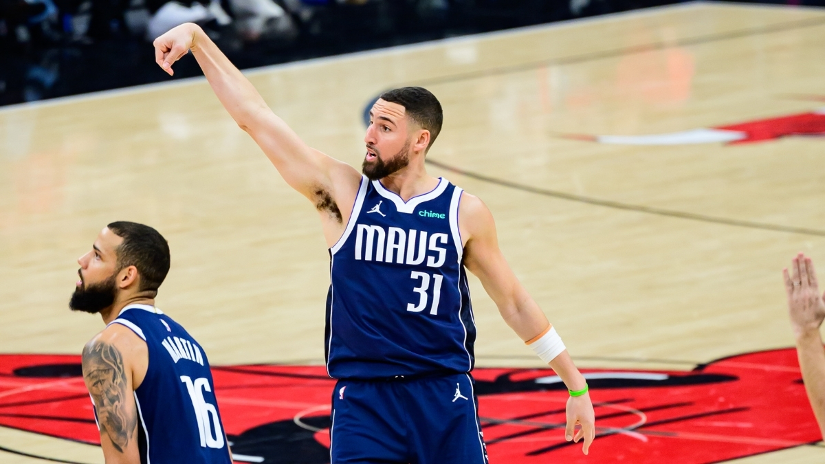 NBA: Klay Thompson holds his follow-through after making a three-pointer for the Dallas Mavericks against the Chicago Bulls