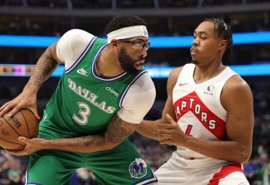 Anthony Davis of the Dallas Mavericks is defended by Scottie Barnes of the Toronto Raptors during the first half at American Airlines Center