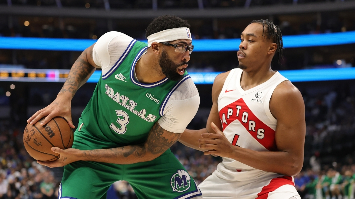 Anthony Davis of the Dallas Mavericks is defended by Scottie Barnes of the Toronto Raptors during the first half at American Airlines Center
