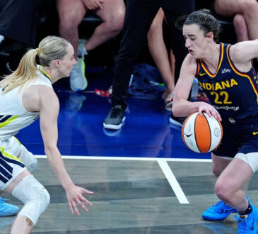WNBA: Indiana Fever guard Caitlin Clark brings the ball up court against Dallas Wings guard Paige Bueckers at Gainbridge Fieldhouse on July 13, 2025