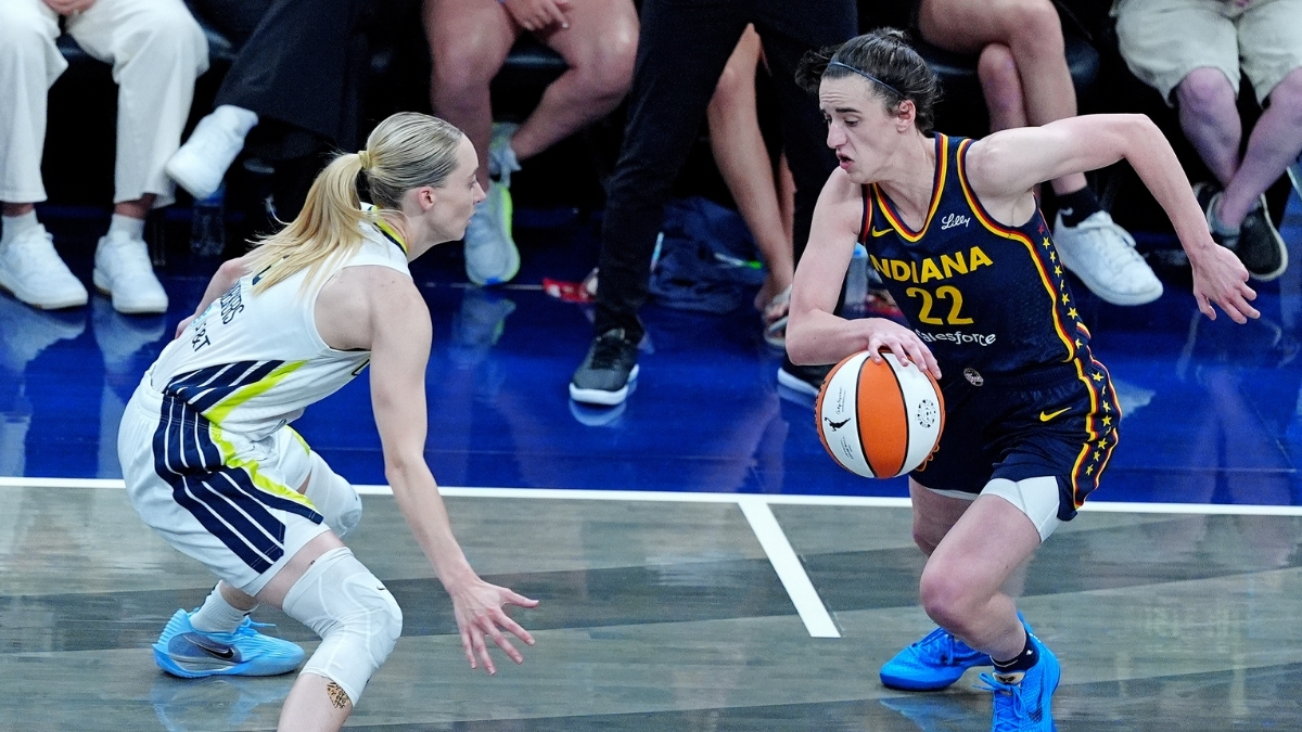WNBA: Indiana Fever guard Caitlin Clark brings the ball up court against Dallas Wings guard Paige Bueckers at Gainbridge Fieldhouse on July 13, 2025