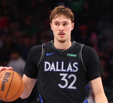 NBA: Cooper Flagg controls the ball for the Dallas Mavericks during the second half against the Golden State Warriors at American Airlines Center