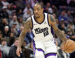 DeMar DeRozan dribbles the ball for the Sacramento Kings against the Toronto Raptors at Golden 1 Center
