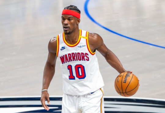 Jimmy Butler dribbles the ball for the Golden State Warriors against the Dallas Mavericks at American Airlines Center