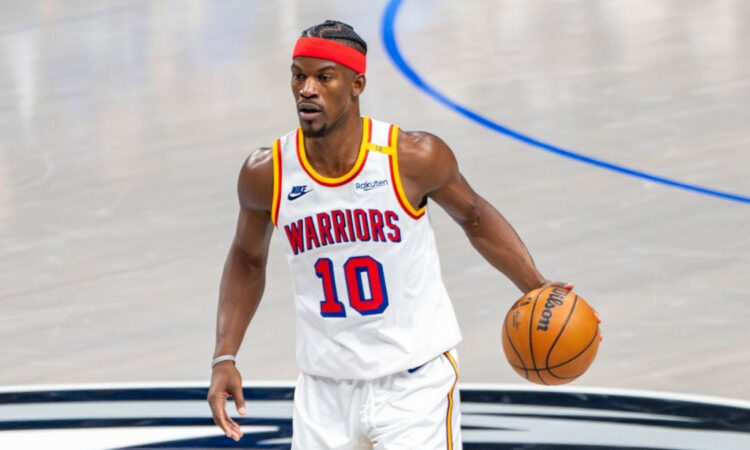 Jimmy Butler dribbles the ball for the Golden State Warriors against the Dallas Mavericks at American Airlines Center