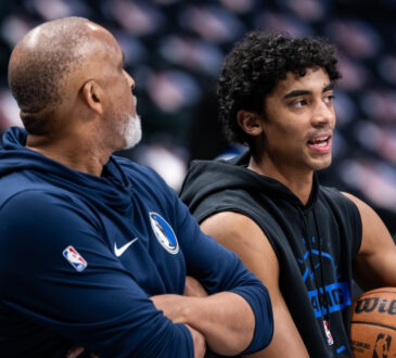 Max Christie talks with assistant coach Phil Handy during a pregame workout at American Airlines Center before Mavericks vs. Nets