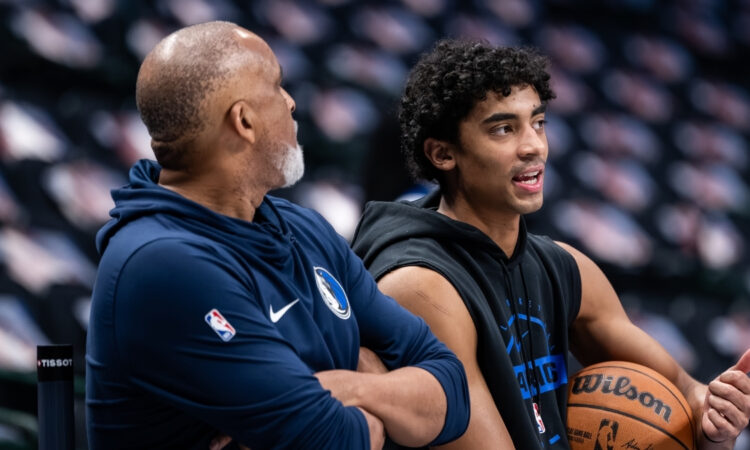 Max Christie talks with assistant coach Phil Handy during a pregame workout at American Airlines Center before Mavericks vs. Nets