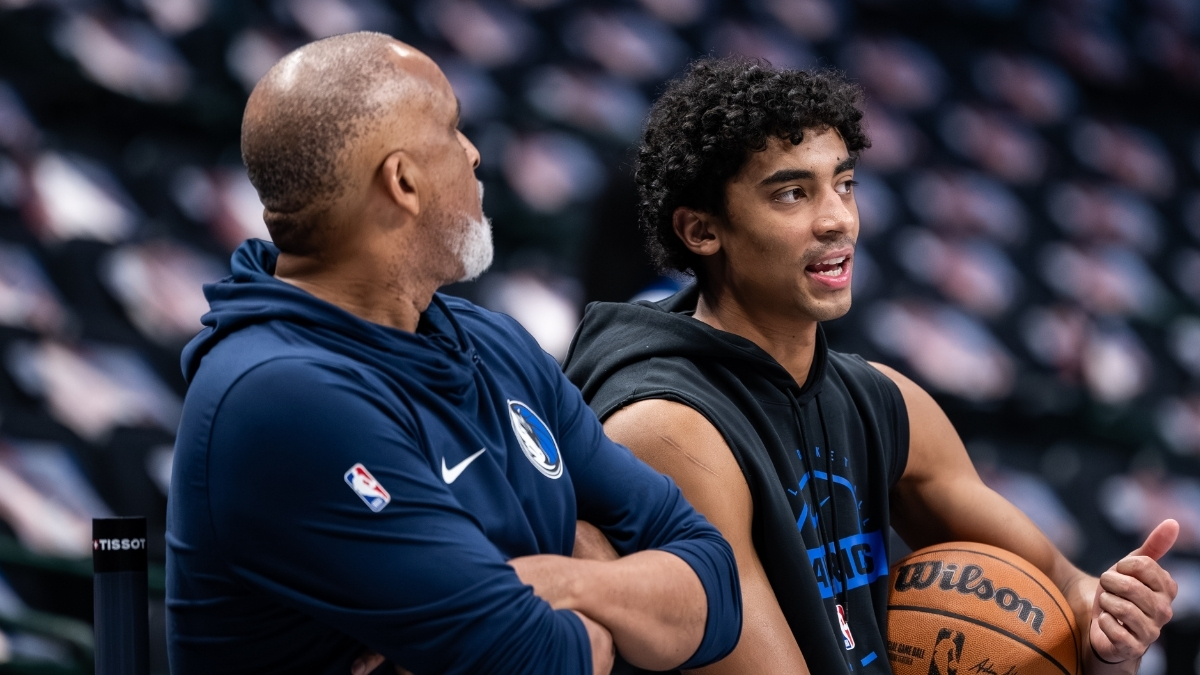 Max Christie talks with assistant coach Phil Handy during a pregame workout at American Airlines Center before Mavericks vs. Nets