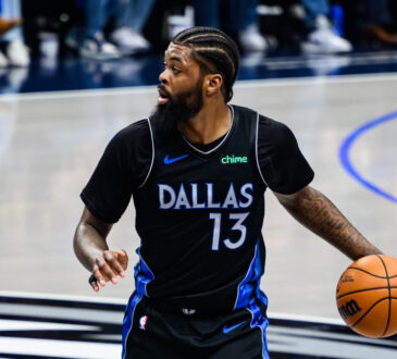 Naji Marshall dribbles the ball at American Airlines Center during a game against the Golden State Warriors