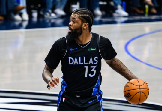 Naji Marshall dribbles the ball at American Airlines Center during a game against the Golden State Warriors
