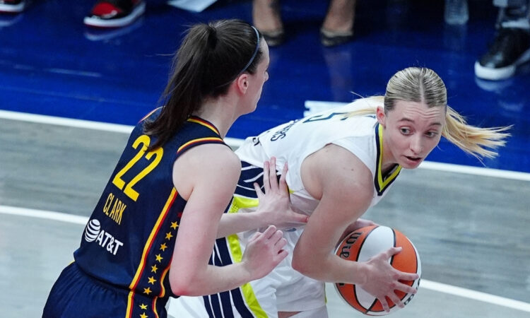 WNBA: Paige Bueckers of the Dallas Wings is guarded by Caitlin Clark of the Indiana Fever at Gainbridge Fieldhouse