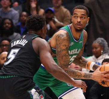 NBA: P.J. Washington is defended by Anthony Edwards during the first quarter at American Airlines Center in a game between the Dallas Mavericks and Minnesota Timberwolves