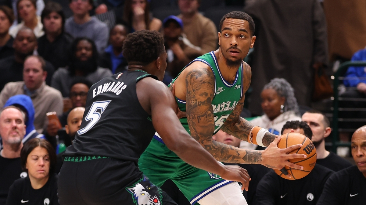 NBA: P.J. Washington is defended by Anthony Edwards during the first quarter at American Airlines Center in a game between the Dallas Mavericks and Minnesota Timberwolves