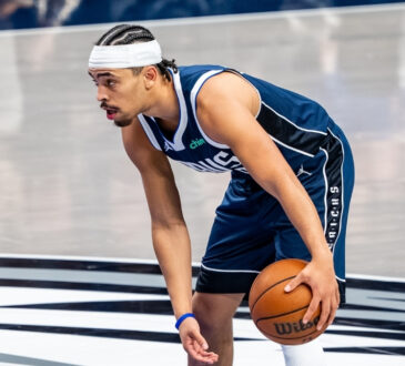 Ryan Nembhard dribbles the ball near midcourt at American Airlines Center before Mavericks vs. Nets