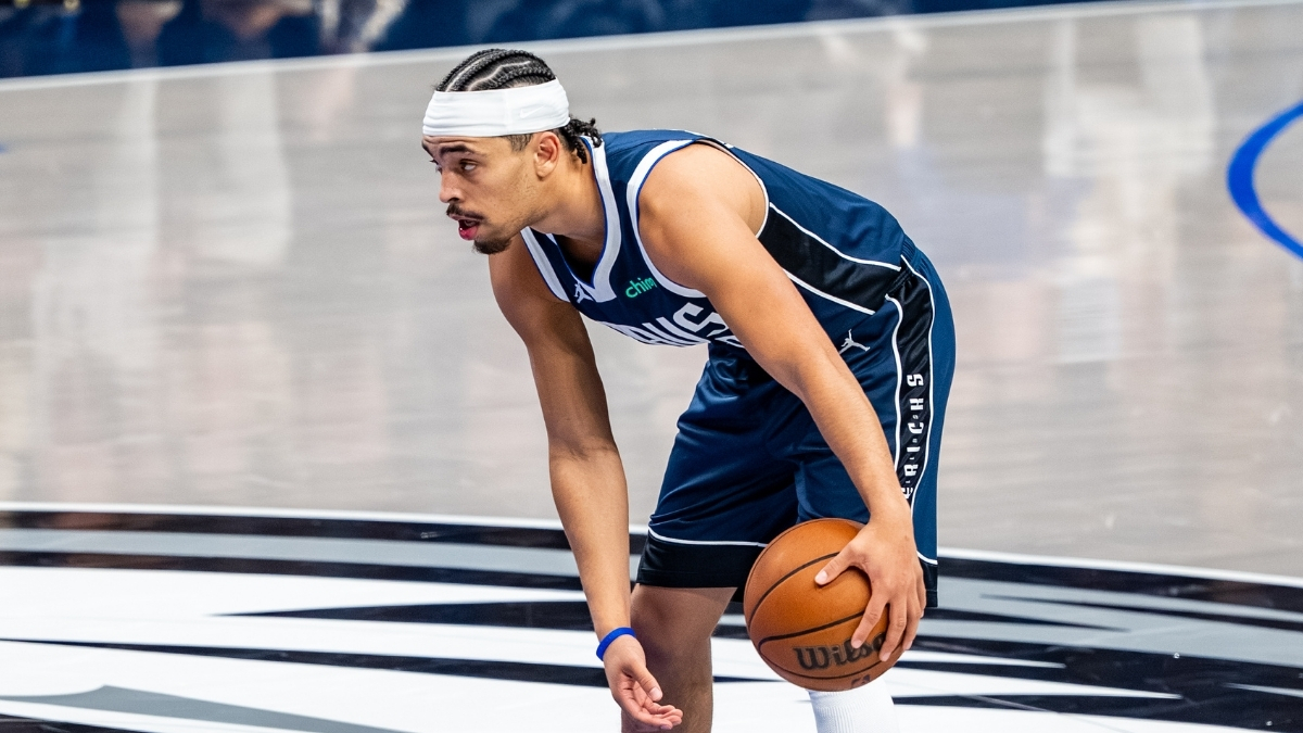 Ryan Nembhard dribbles the ball near midcourt at American Airlines Center before Mavericks vs. Nets