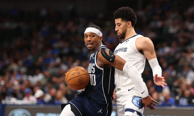 NBA: Brandon Williams drives the ball for the Dallas Mavericks while defended by Scotty Pippen Jr. of the Memphis Grizzlies during the fourth quarter at American Airlines Center.