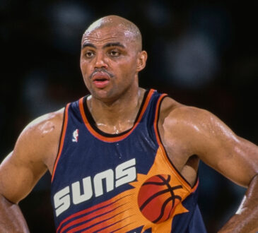 NBA: Charles Barkley looks on with his hands on his hips during a Phoenix Suns game against the Denver Nuggets at McNichols Sports Arena.