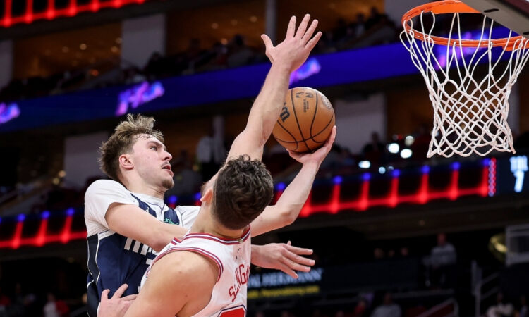 NBA: Cooper Flagg shoots the ball for the Dallas Mavericks against Alperen Sengun of the Houston Rockets at Toyota Center