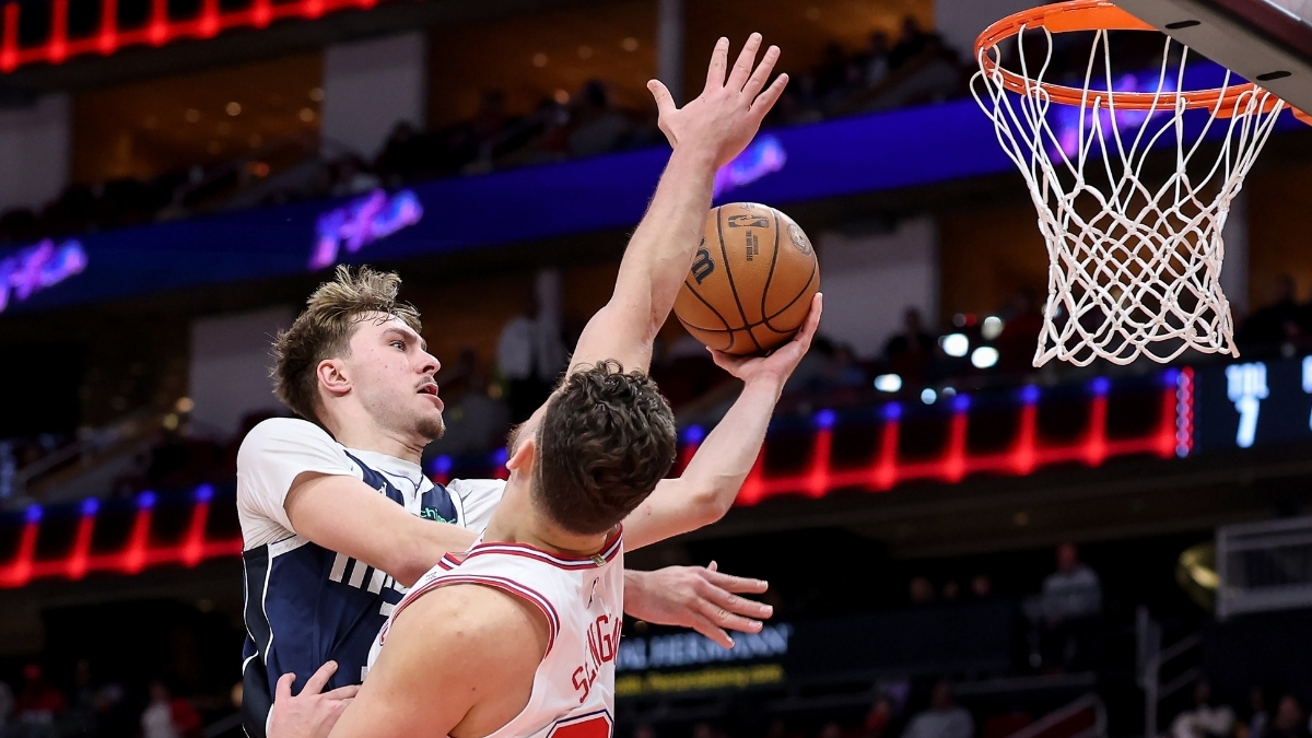 NBA: Cooper Flagg shoots the ball for the Dallas Mavericks against Alperen Sengun of the Houston Rockets at Toyota Center