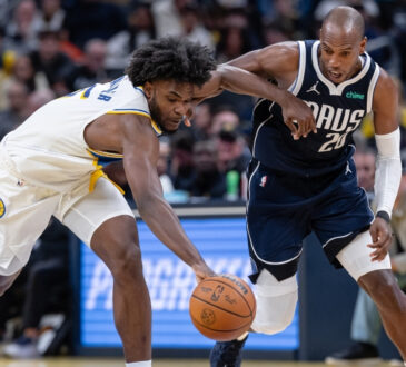 NBA: Khris Middleton of the Dallas Mavericks and Jarace Walker of the Indiana Pacers chase a loose ball during the first half at Gainbridge Fieldhouse against the Indiana Pacers.