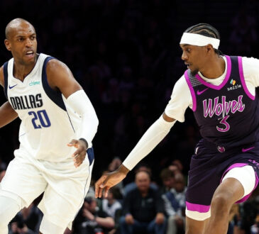 NBA: Khris Middleton dribbles against Jaden McDaniels during the fourth quarter at Target Center as the Dallas Mavericks face the Minnesota Timberwolves.