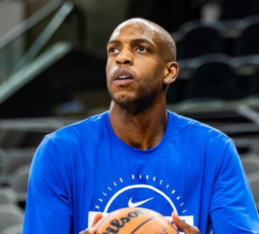 NBA: Khris Middleton shoots during pregame warmups for the Dallas Mavericks in San Antonio before a road game