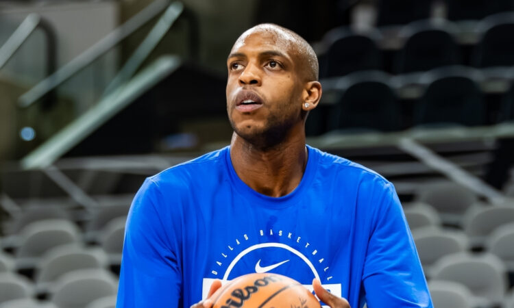 NBA: Khris Middleton shoots during pregame warmups for the Dallas Mavericks in San Antonio before a road game