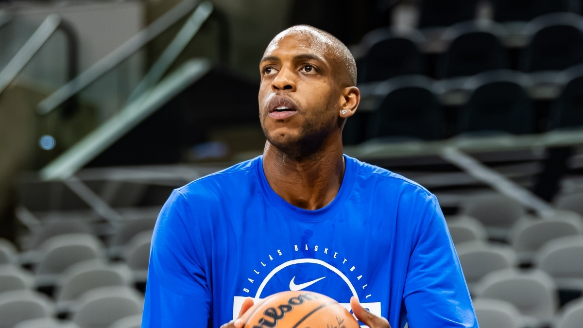 NBA: Khris Middleton shoots during pregame warmups for the Dallas Mavericks in San Antonio before a road game