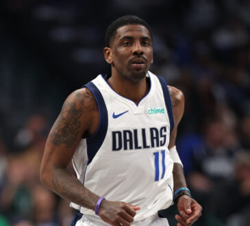 NBA: Kyrie Irving looks on from the court during the first half at American Airlines Center against the Charlotte Hornets