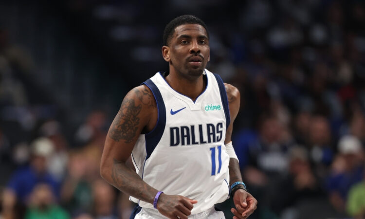 NBA: Kyrie Irving looks on from the court during the first half at American Airlines Center against the Charlotte Hornets