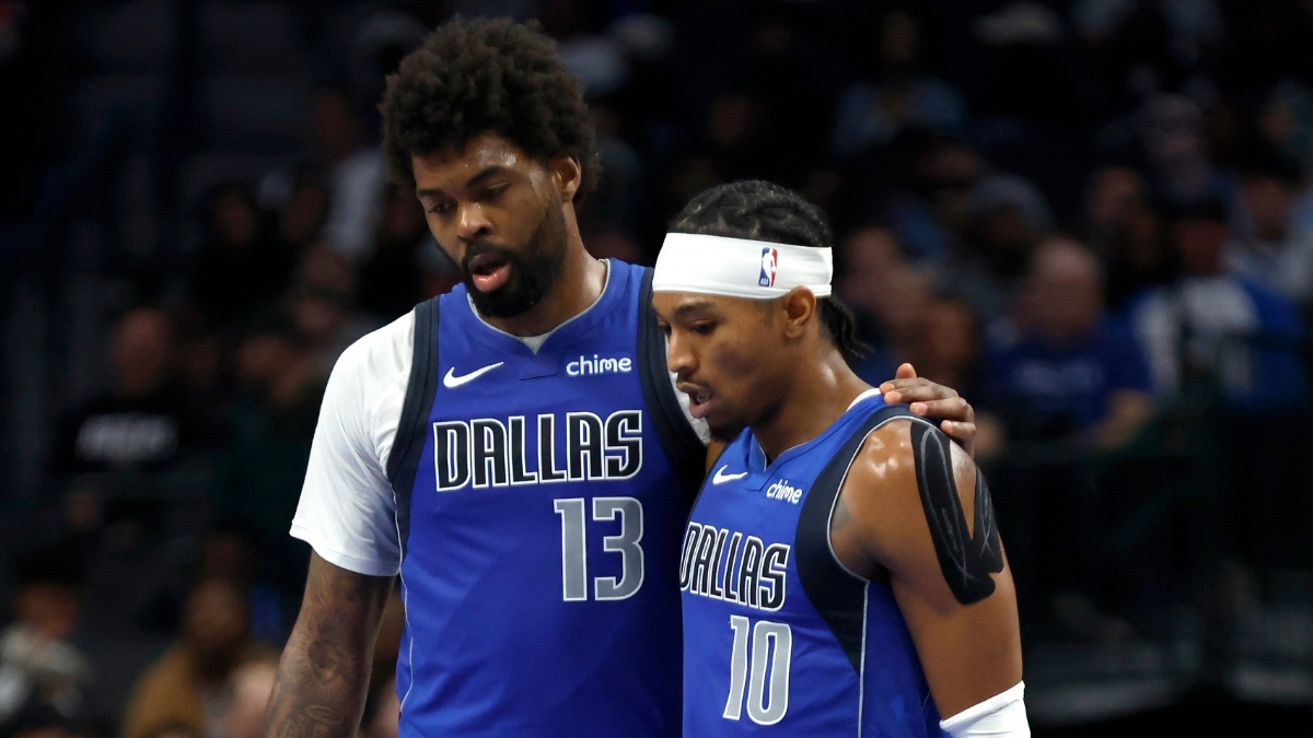 NBA: Naji Marshall and Brandon Williams walk to the bench during the second half of the Dallas Mavericks game against the Sacramento Kings at American Airlines Center.