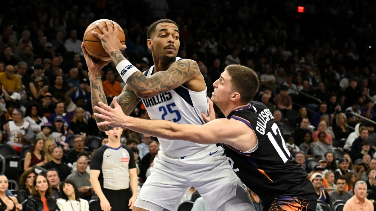 NBA: P.J. Washington looks to pass the ball for the Dallas Mavericks while defended by Collin Gillespie at Mortgage Matchup Center against the Phoenix Suns.