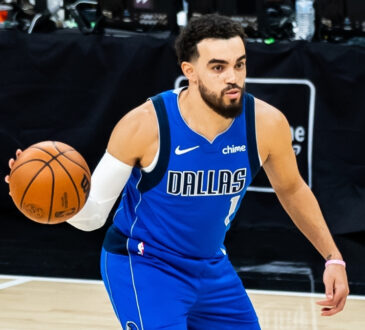 NBA: Tyus Jones passes the ball during his Dallas Mavericks debut in San Antonio