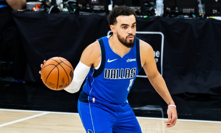 NBA: Tyus Jones passes the ball during his Dallas Mavericks debut in San Antonio