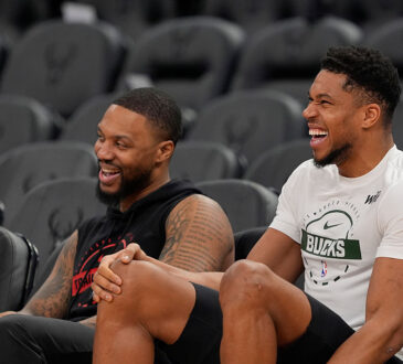 Portland Trail Blazers guard Damian Lillard talks to Milwaukee Bucks forward Giannis Antetokounmpo