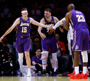 NBA players Luka Dončić, Austin Reaves and LeBron James of the Los Angeles Lakers
