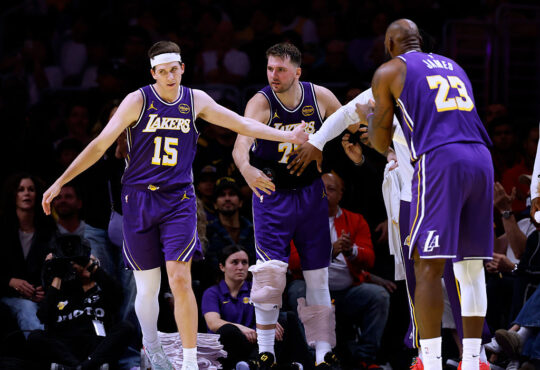 NBA players Luka Dončić, Austin Reaves and LeBron James of the Los Angeles Lakers