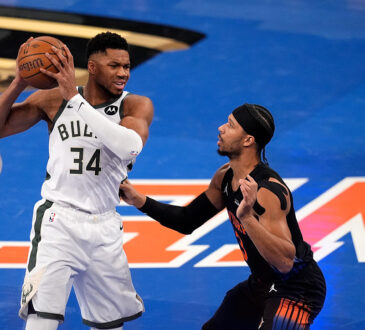 Josh Hart guards Giannis Antetokounmpo