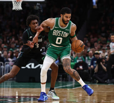 Minnesota Timberwolves forward Jaden McDaniels guards Boston Celtics forward Jayson Tatum