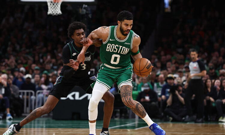 Minnesota Timberwolves forward Jaden McDaniels guards Boston Celtics forward Jayson Tatum