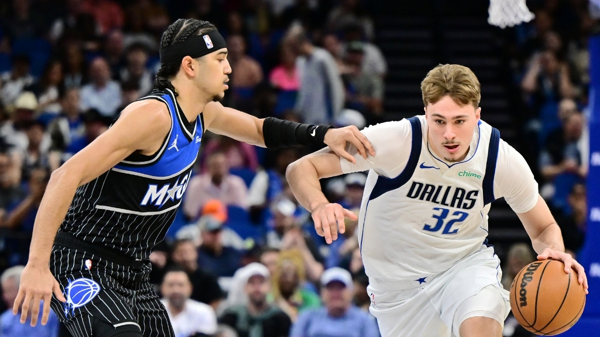 Cooper Flagg #32 of the Dallas Mavericks goes to the basket against Anthony Black #0 of the Orlando Magic at Kia Center on March 5, 2026 in Orlando, Florida.