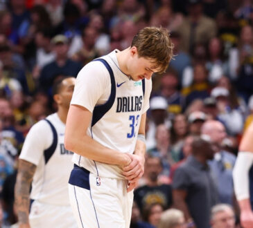 Dallas Mavericks forward Cooper Flagg reacts after suffering a right hand injury in the fourth quarter against the Denver Nuggets on March 25, 2026 in Denver.