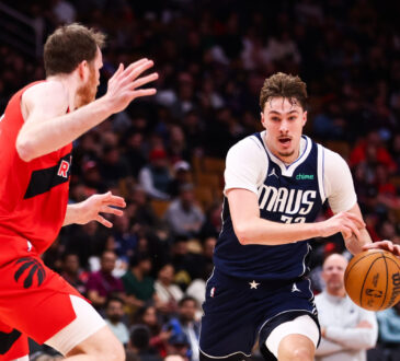 Cooper Flagg #32 of the Dallas Mavericks drives to the basket against Jakob Poeltl #19 of the Toronto Raptors at Scotiabank Arena on March 8, 2026.