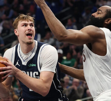 Cooper Flagg #32 of the Dallas Mavericks is defended by James Harden #1 of the Cleveland Cavaliers during the first half at American Airlines Center on March 13, 2026 in Dallas, Texas.