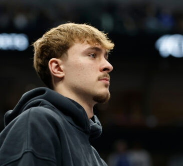 NBA: Cooper Flagg sits on the bench during a timeout at American Airlines Center against the Sacramento Kings
