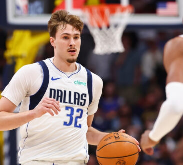 Cooper Flagg of the Dallas Mavericks controls the ball against the Denver Nuggets in the second quarter at Ball Arena on March 25, 2026.