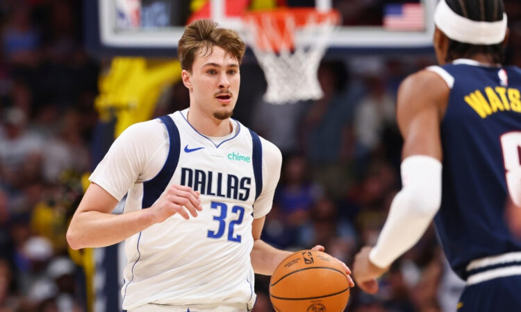 Cooper Flagg of the Dallas Mavericks controls the ball against the Denver Nuggets in the second quarter at Ball Arena on March 25, 2026.