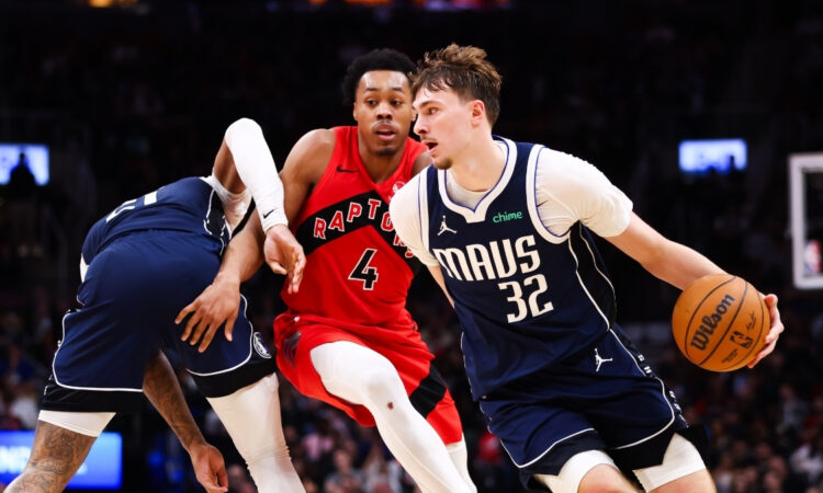 Cooper Flagg #32 of the Dallas Mavericks drives to the basket against Scottie Barnes #4 of the Toronto Raptors at Scotiabank Arena on March 8, 2026.
