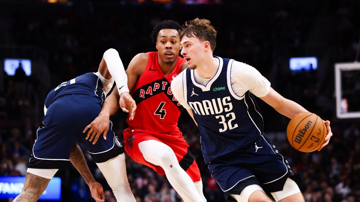 Cooper Flagg #32 of the Dallas Mavericks drives to the basket against Scottie Barnes #4 of the Toronto Raptors at Scotiabank Arena on March 8, 2026.