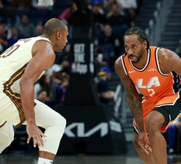 Kawhi Leonard of the LA Clippers drives toward the basket while being guarded by Al Horford of the Golden State Warriors at Chase Center.